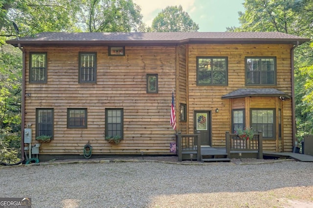 view of front of property with a wooden deck