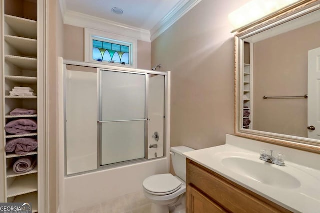 full bathroom with vanity, crown molding, shower / bath combination with glass door, tile patterned flooring, and toilet