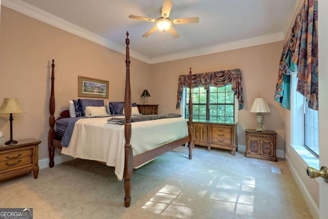 bedroom with carpet, ceiling fan, and ornamental molding