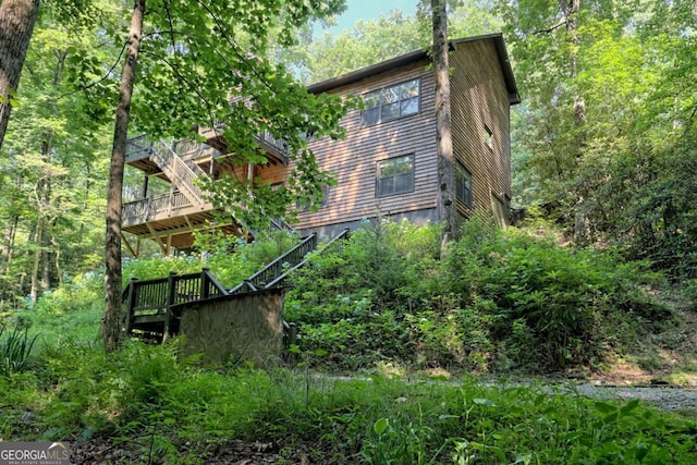 view of home's exterior with a wooden deck