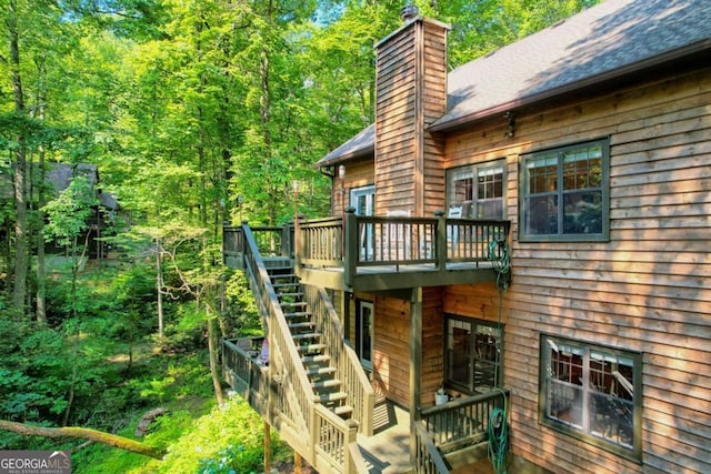 view of side of home featuring a wooden deck