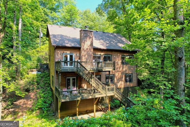 back of house with french doors and a wooden deck