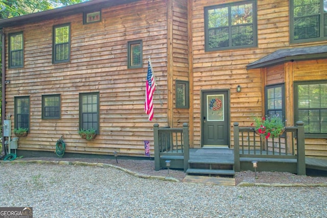 view of front of property with a wooden deck