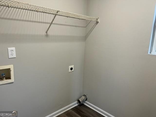 clothes washing area with dark hardwood / wood-style floors, washer hookup, and electric dryer hookup