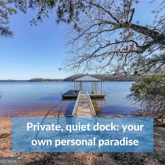 dock area featuring a water view