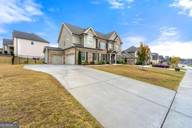 view of front of home featuring a front yard and a garage