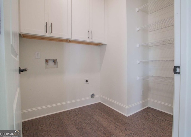 washroom featuring electric dryer hookup, dark hardwood / wood-style floors, cabinets, and hookup for a washing machine