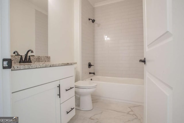 full bathroom with vanity, tiled shower / bath combo, and toilet