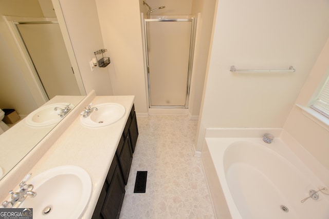 bathroom featuring separate shower and tub and vanity