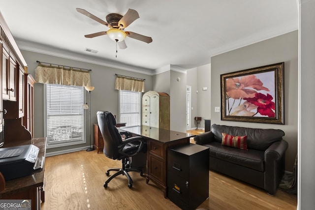 office with ceiling fan, ornamental molding, and light hardwood / wood-style flooring