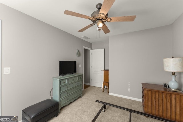 bedroom featuring light carpet and ceiling fan