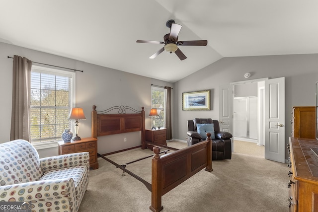 2352 Kelman Pl, Dacula, GA 30019 - bedroom featuring vaulted ceiling, light carpet, ceiling fan, connected bathroom, and baseboards