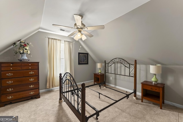 bedroom with vaulted ceiling, light carpet, and ceiling fan