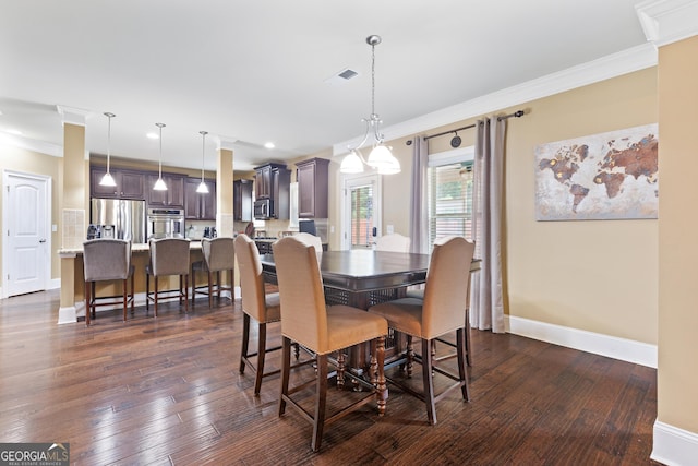 dining space with dark wood-type flooring and crown molding