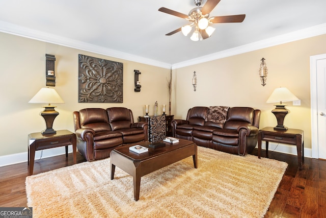 living room featuring dark hardwood / wood-style floors, ceiling fan, and ornamental molding