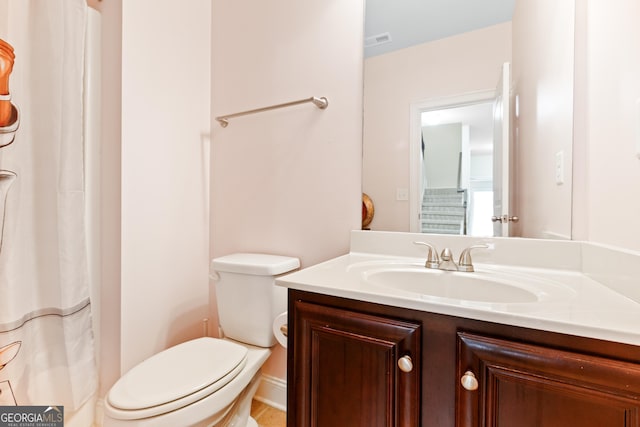 bathroom with vanity and toilet