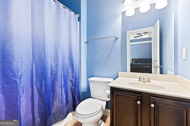 bathroom featuring curtained shower, ceiling fan, vanity, and toilet