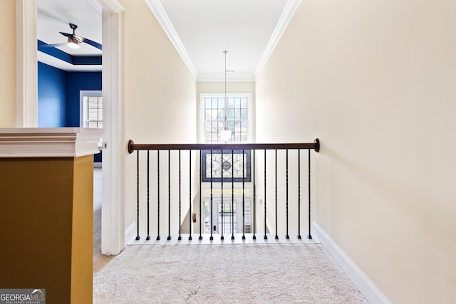 hallway with light carpet and crown molding