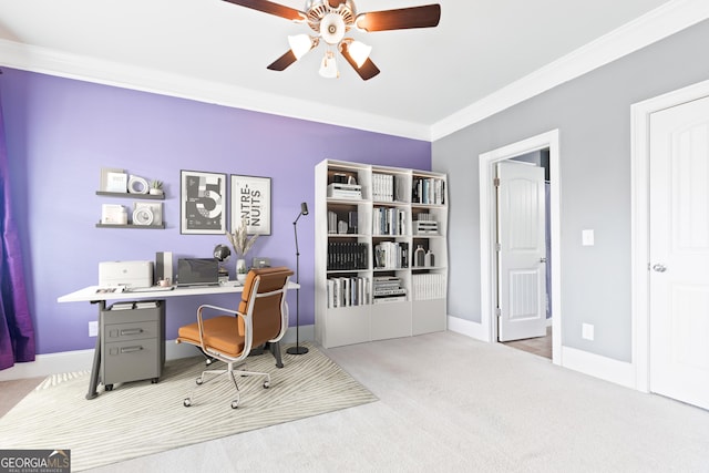 carpeted office space with ceiling fan and ornamental molding