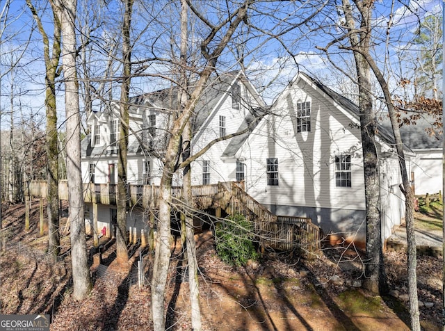 view of side of property with a wooden deck