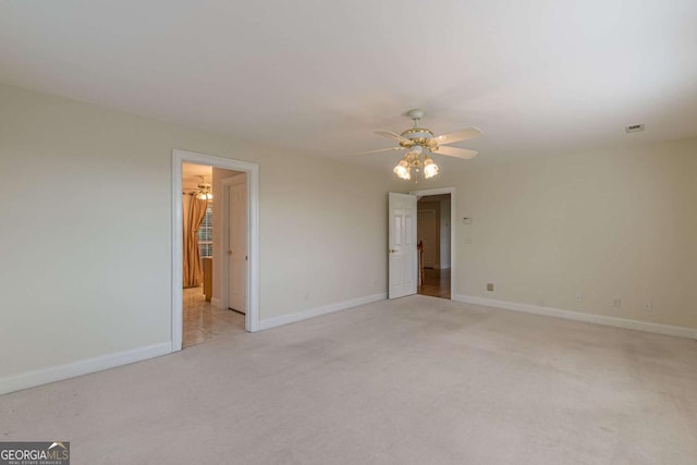 carpeted empty room with ceiling fan