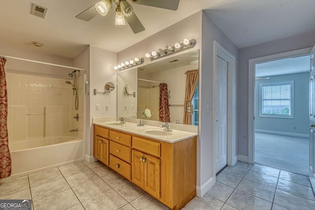 bathroom with tile patterned flooring, ceiling fan, vanity, and shower / tub combo with curtain