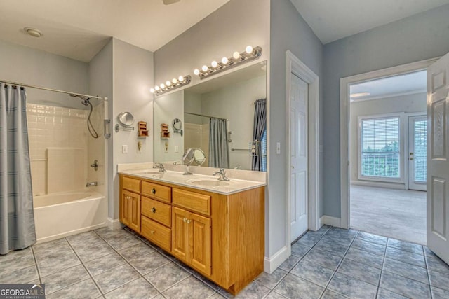 bathroom with vanity, tile patterned floors, and shower / bath combo with shower curtain