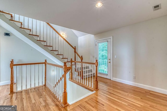 staircase featuring hardwood / wood-style floors