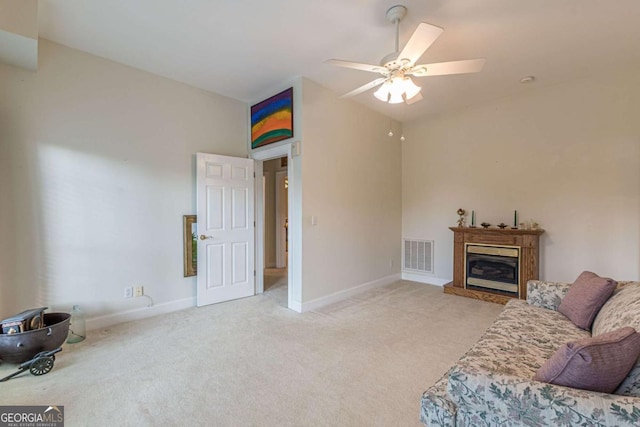 carpeted living room featuring ceiling fan