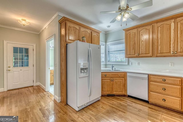 kitchen with stainless steel dishwasher, white fridge with ice dispenser, crown molding, and sink