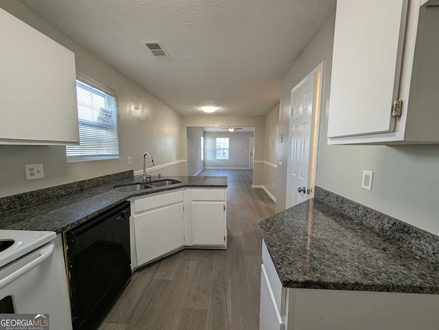 kitchen with dishwasher, sink, a textured ceiling, dark hardwood / wood-style flooring, and white cabinetry