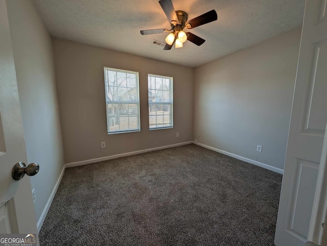 carpeted empty room with a textured ceiling and ceiling fan