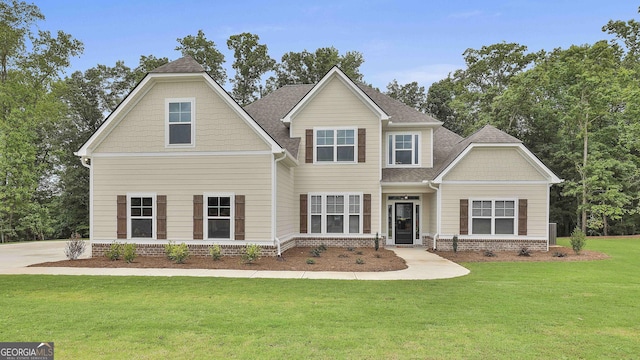 craftsman-style house featuring a front yard