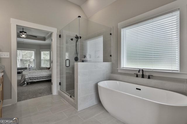 bathroom featuring tile patterned floors, vanity, ceiling fan, independent shower and bath, and lofted ceiling