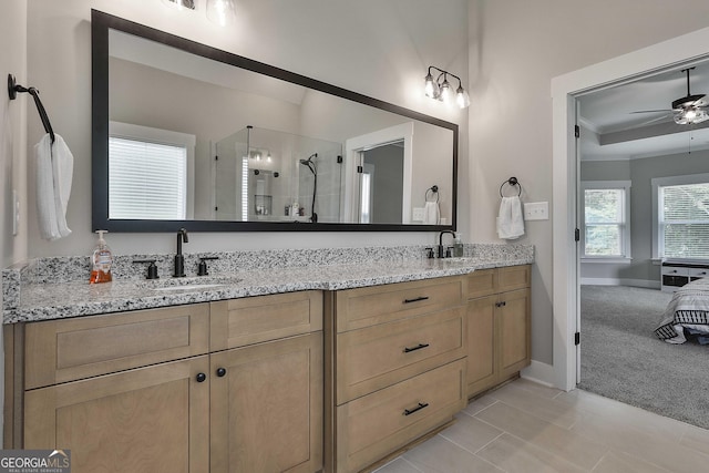 bathroom featuring ceiling fan, tile patterned flooring, vanity, and walk in shower