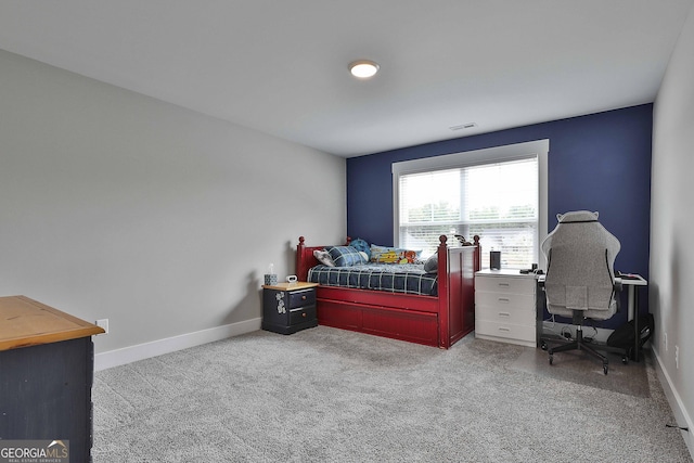 bedroom featuring light carpet