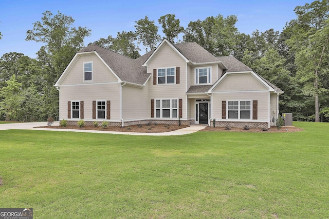 craftsman inspired home with central AC unit and a front yard