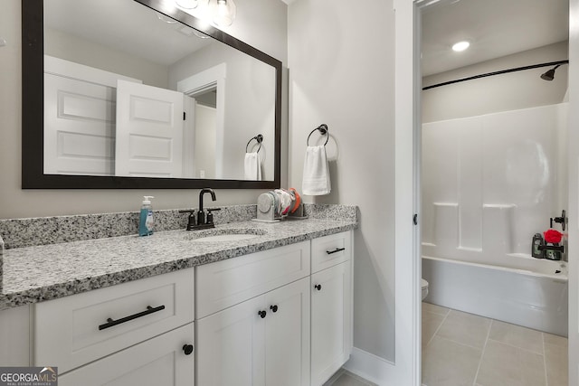 full bathroom featuring tile patterned flooring, vanity,  shower combination, and toilet