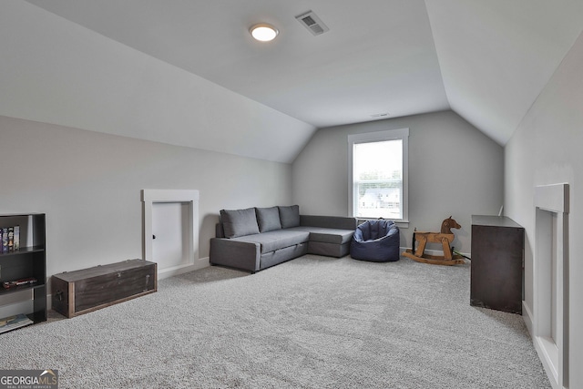 living room with light carpet and vaulted ceiling