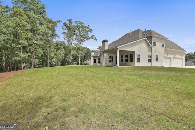 back of house featuring a yard