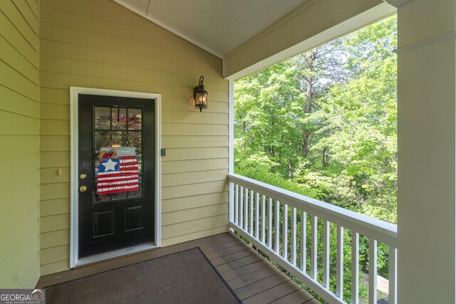 doorway to property featuring a balcony