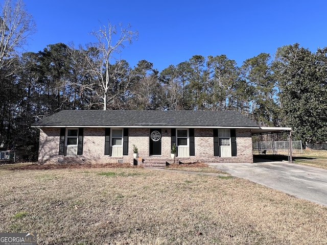 ranch-style home featuring a front yard and a carport