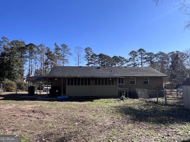 back of property featuring a carport