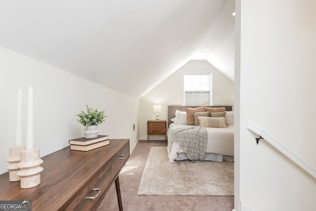 carpeted bedroom featuring vaulted ceiling