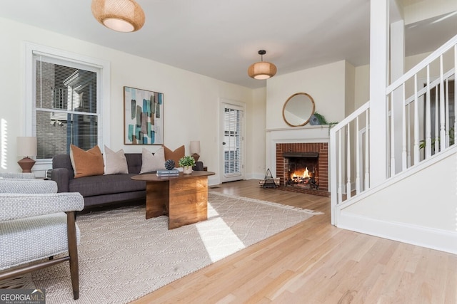 living room with a fireplace and hardwood / wood-style floors