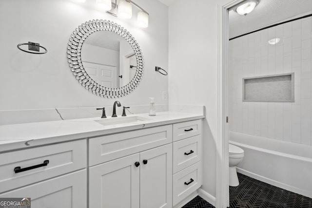 full bathroom featuring tiled shower / bath combo, vanity, and toilet