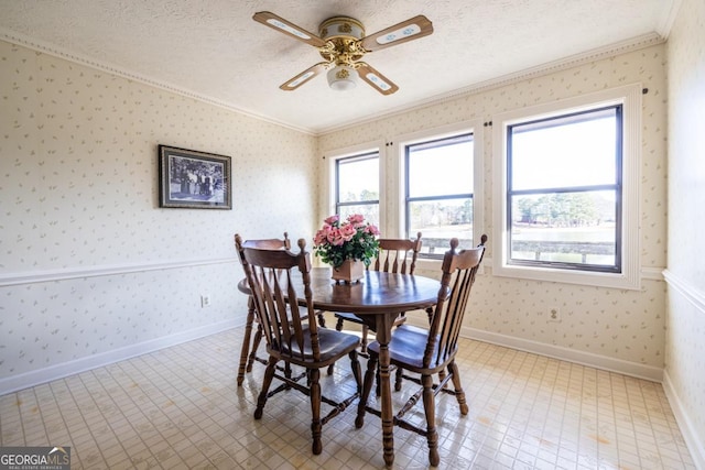 dining room featuring crown molding, ceiling fan, and a textured ceiling