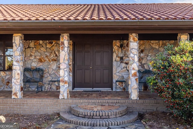 doorway to property with a porch