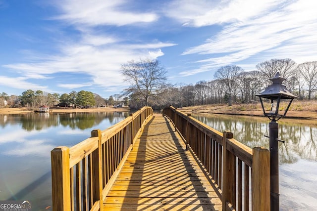 view of dock featuring a gazebo and a water view