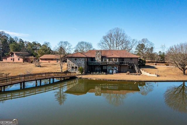 rear view of house with a water view